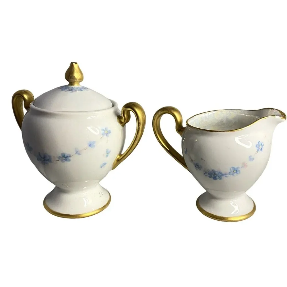 #8191 VINTAGE MADE IN JAPAN SUGAR BOWL AND CREAMER WITH LIGHT BLUE FLOWERS